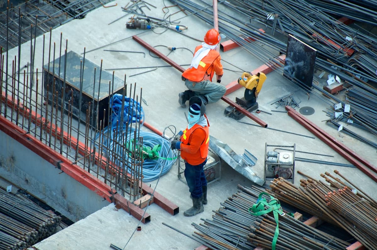 Contractor reviewing a quality checklist on a clipboard at a job site